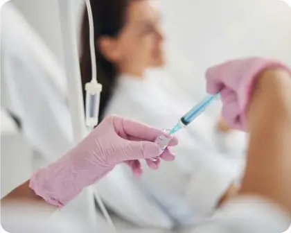 Healthcare professional administering an IV infusion
