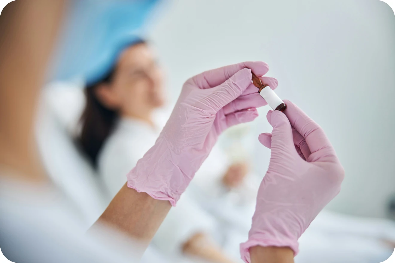 Healthcare professional preparing IV medication
